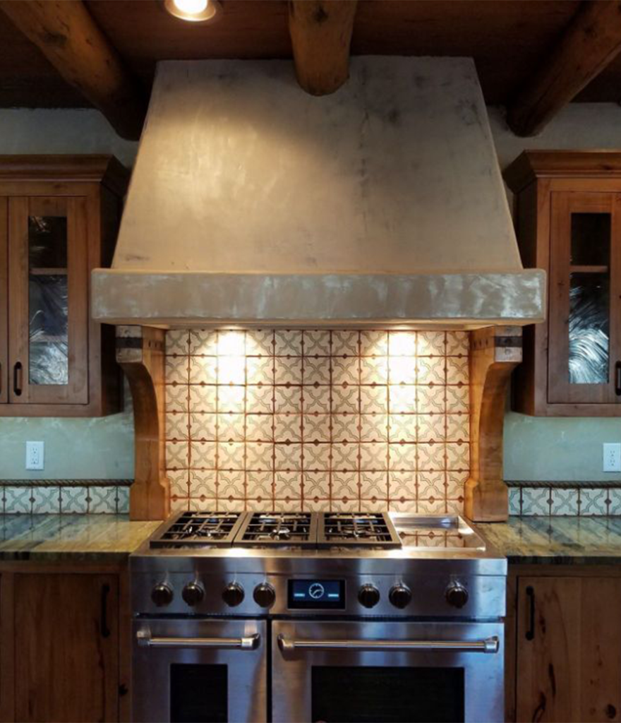 Kitchen remodel with custom hood vent and gas range